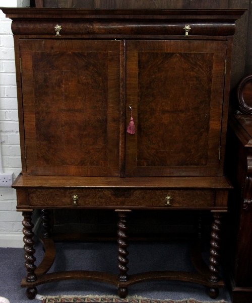 Appraisal: A William and Mary style cabinet on stand the veneered