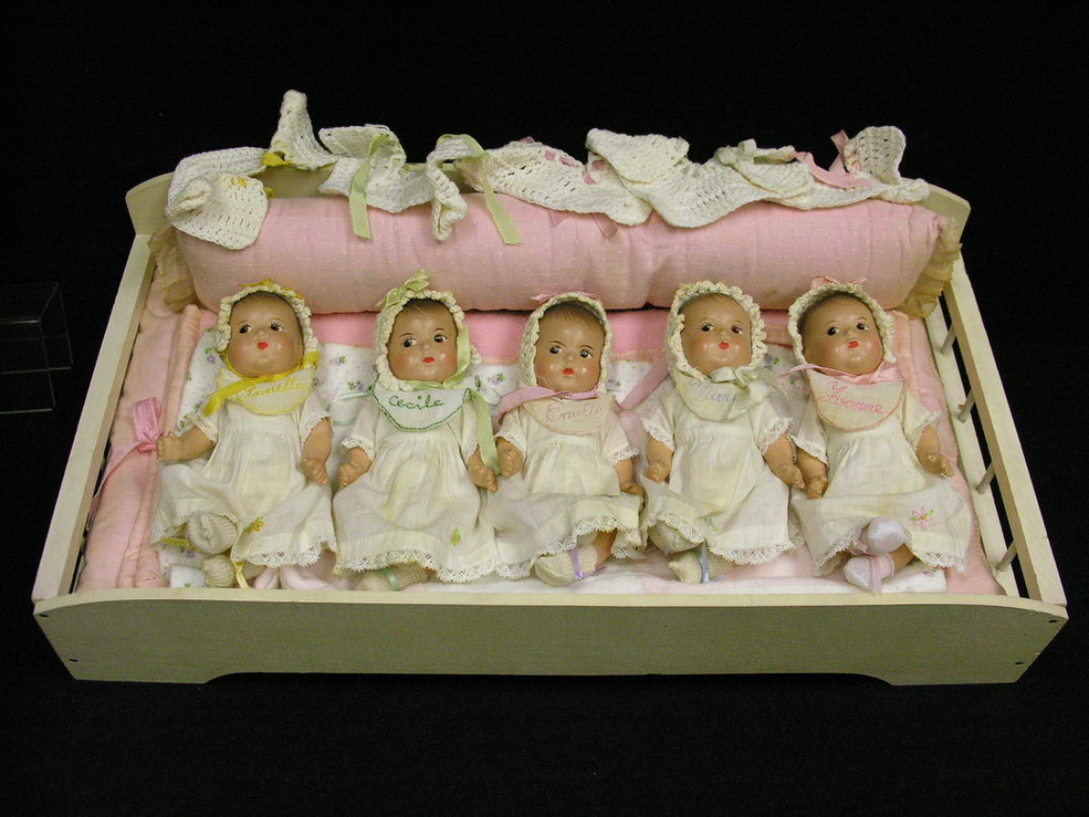 Appraisal: DIONNE QUINTUPLETS BY MADAME ALEXANDER IN BED Dionne Quintuplet baby