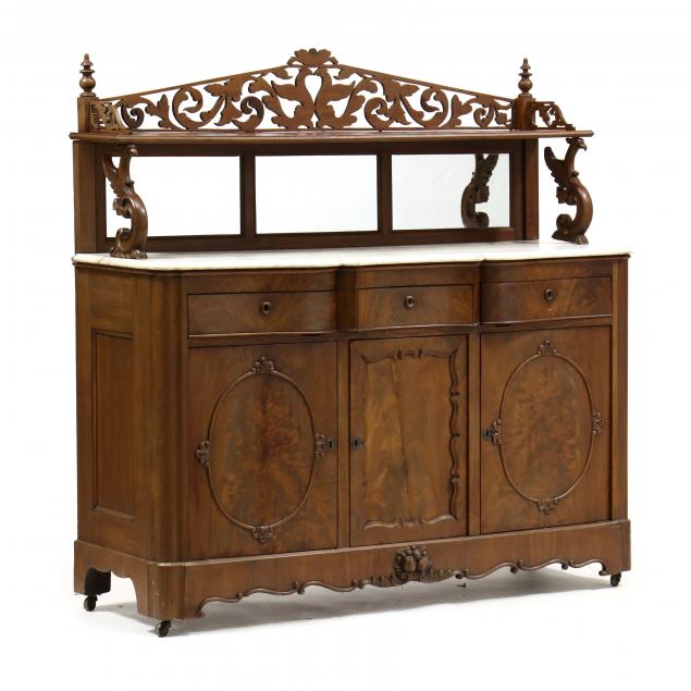 Appraisal: AMERICAN ROCOCO REVIVAL MAHOGANY MARBLE TOP SIDEBOARD Circa mahogany veneer