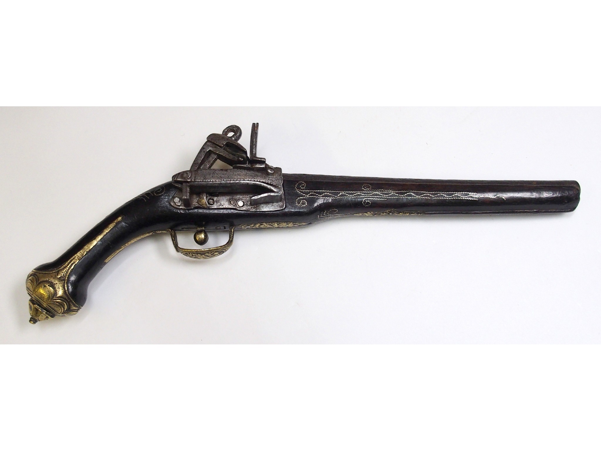 Appraisal: An Indo-Persian flintlock pistolthe steel barrel cm ling with cast