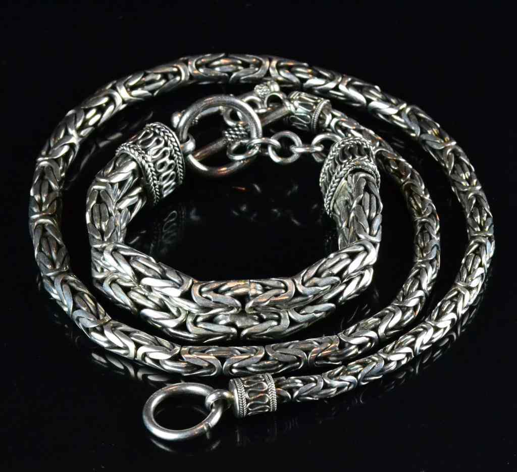 Appraisal: Pcs Sterling Chain Necklace and BraceletConsisting of matching sterling intertwining