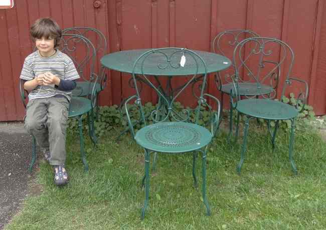 Appraisal: Patio set in green paint includes table and five chairs