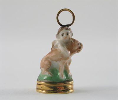 Appraisal: A Chelsea seal with gold mounts modelled as a putti