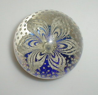 Appraisal: A large paperweight royal blue base enclosed opaque flower and