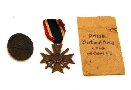 Appraisal: Lot includes a German WWII War Service Cross with swords