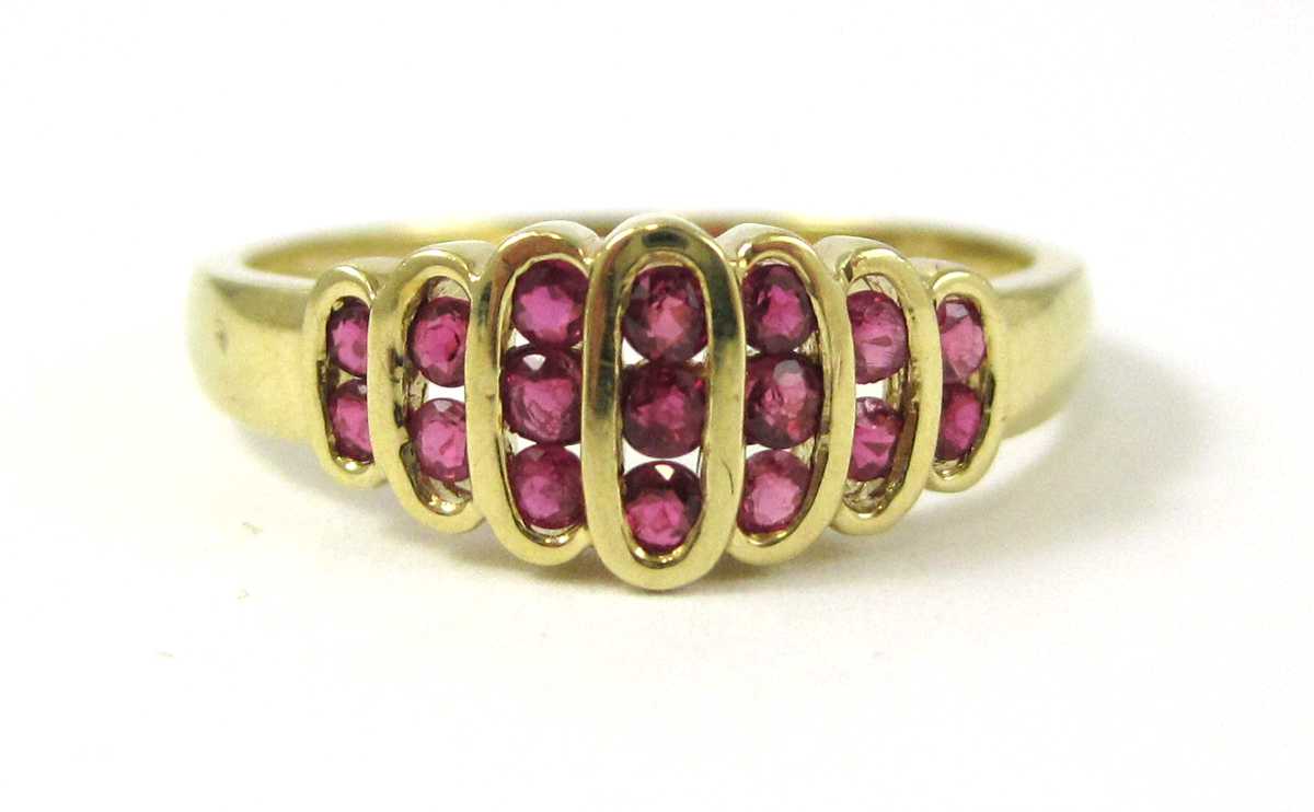 Appraisal: RUBY AND FOURTEEN KARAT GOLD RING featuring round-cut red rubies