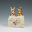 Appraisal: Bear cub salt pepper nodders on a floral base Marked