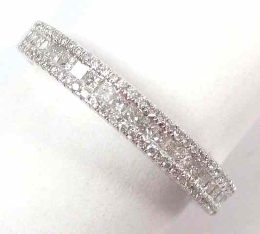 Appraisal: DIAMOND AND FOURTEEN KARAT WHITE GOLD RING set with round-cut