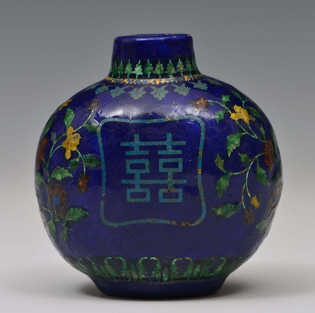 Appraisal: A CHINESE POTTERY SNUFF BOTTLE of rounded bulbous form decorated