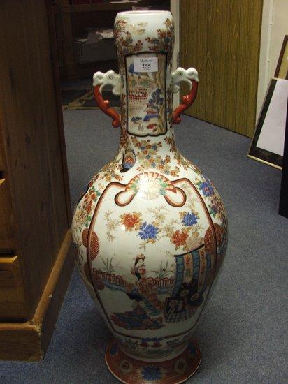 Appraisal: A JAPANESE PORCELAIN TWO HANDLE BALUSTER VASE the iron red