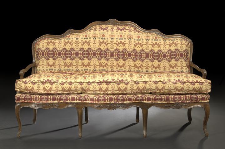 Appraisal: Provincial Louis XV-Style Walnut Sofa first quarter th century the