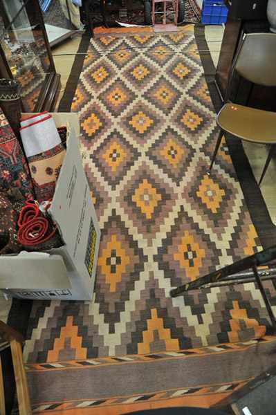 Appraisal: AN AFGHAN KILIM HALL RUNNER IN BROWN ORANGE AND CREAM