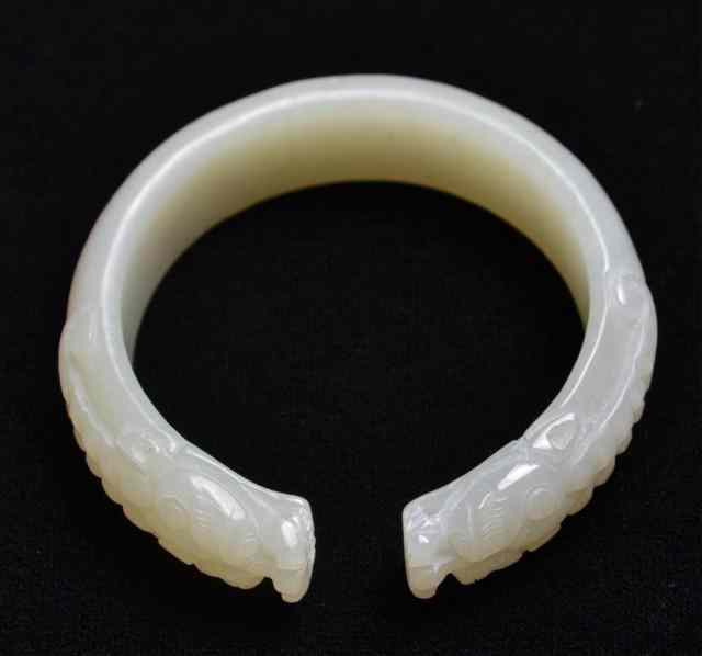 Appraisal: Chinese Carved Jade BraceletCarved and finely polished light green jade