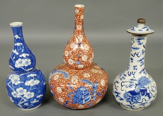 Appraisal: - Two th c Asian porcelain gourd bottles largest h