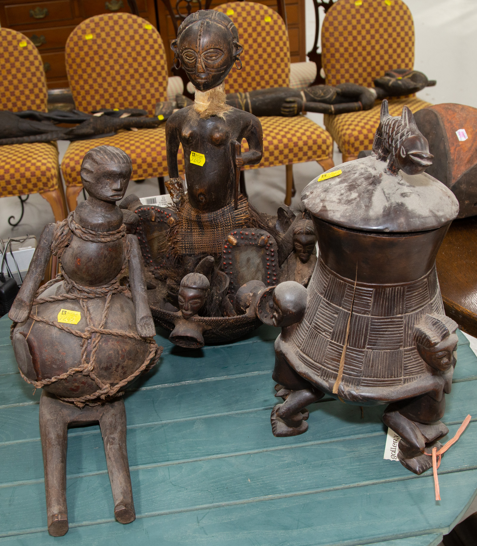 Appraisal: THREE AFRICAN WOOD CARVINGS th century comprising a Chokwe shrine