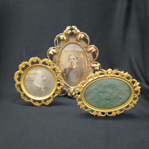 Appraisal: Victorian Brass Frames rococo designs one enameled largest is x