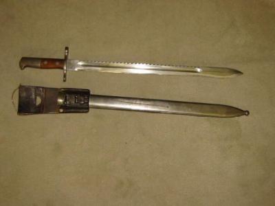 Appraisal: A SWISS SCHMITT-RUBIN BAYONET with wood and steel grip saw