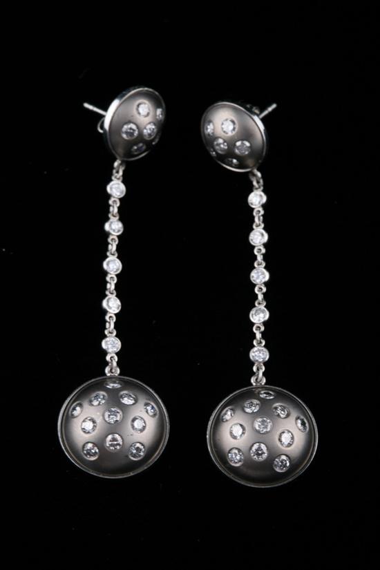 Appraisal: PAIR TITANIUM PLATINUM AND DIAMOND DROP EARRINGS Two domed and