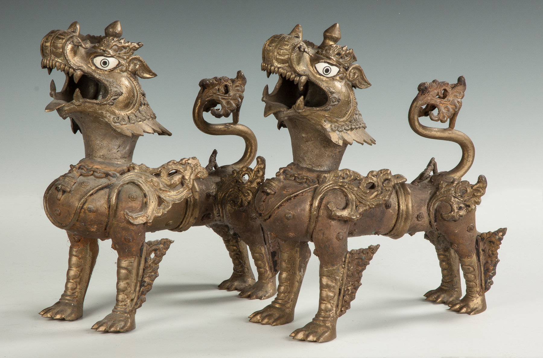 Appraisal: Temple Dragon Censors th cent Cast brass painted bone eyes