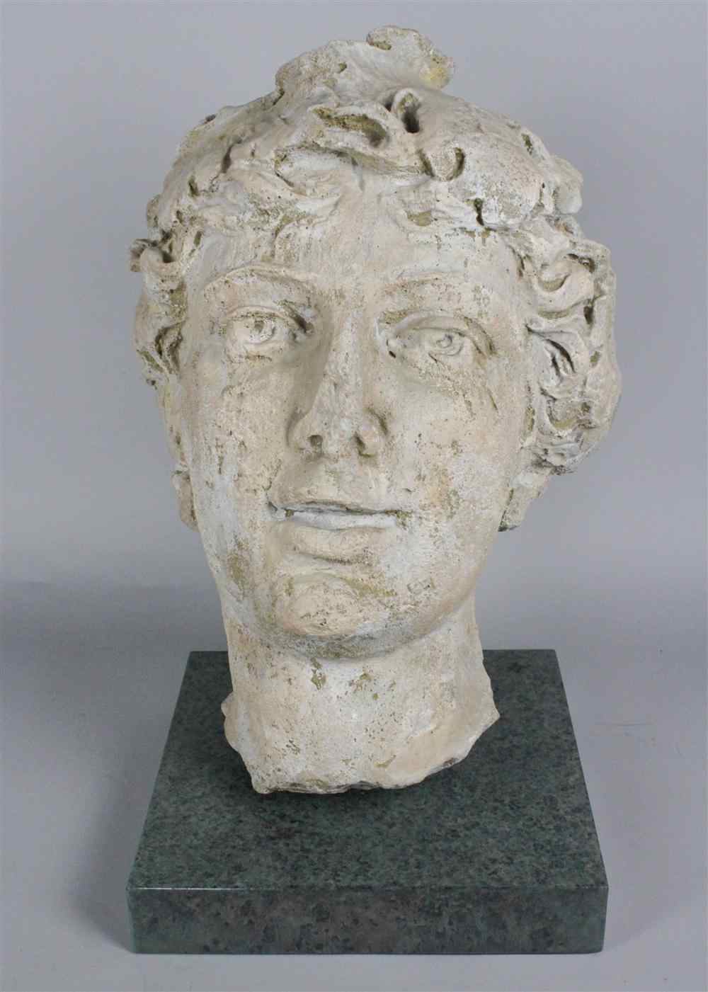 Appraisal: CLASSICAL HEAD ON A GREEN STONE BASE of composite -