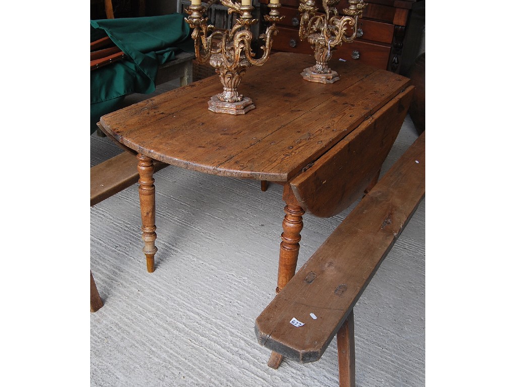 Appraisal: An unusual circular th century French pine fruitwood kitchen table