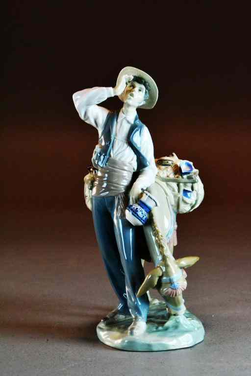 Appraisal: Lladro Figure of Peddler Donkey Salvador FurioDepicting peddler selling porcelain