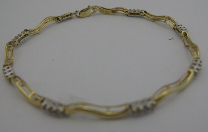 Appraisal: DIAMOND AND K YELLOW AND WHITE GOLD BRACELET - in