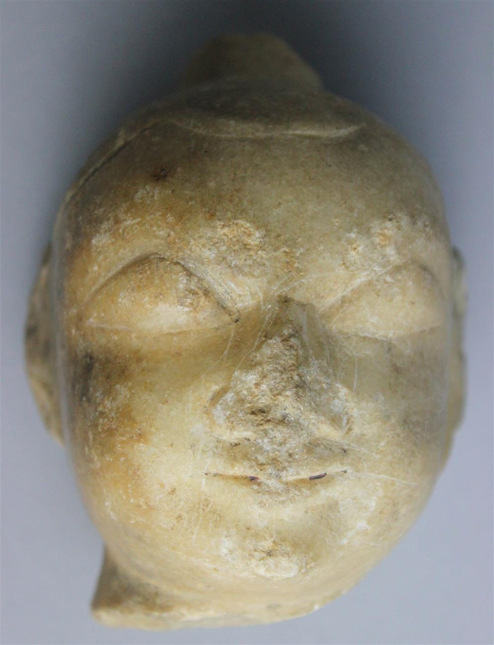 Appraisal: SOUTHEAST ASIAN WHITE STONE HEAD OF THE BUDDHA probably Khmer