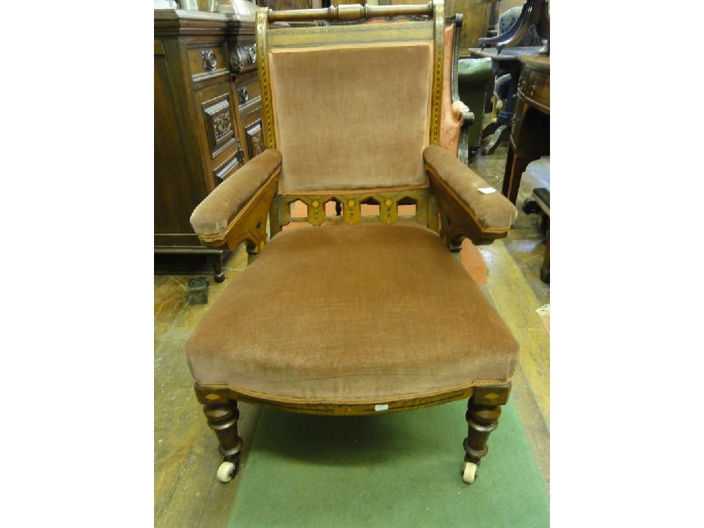 Appraisal: A Victorian gothic revival oak armchair with serpentine upholstered seat