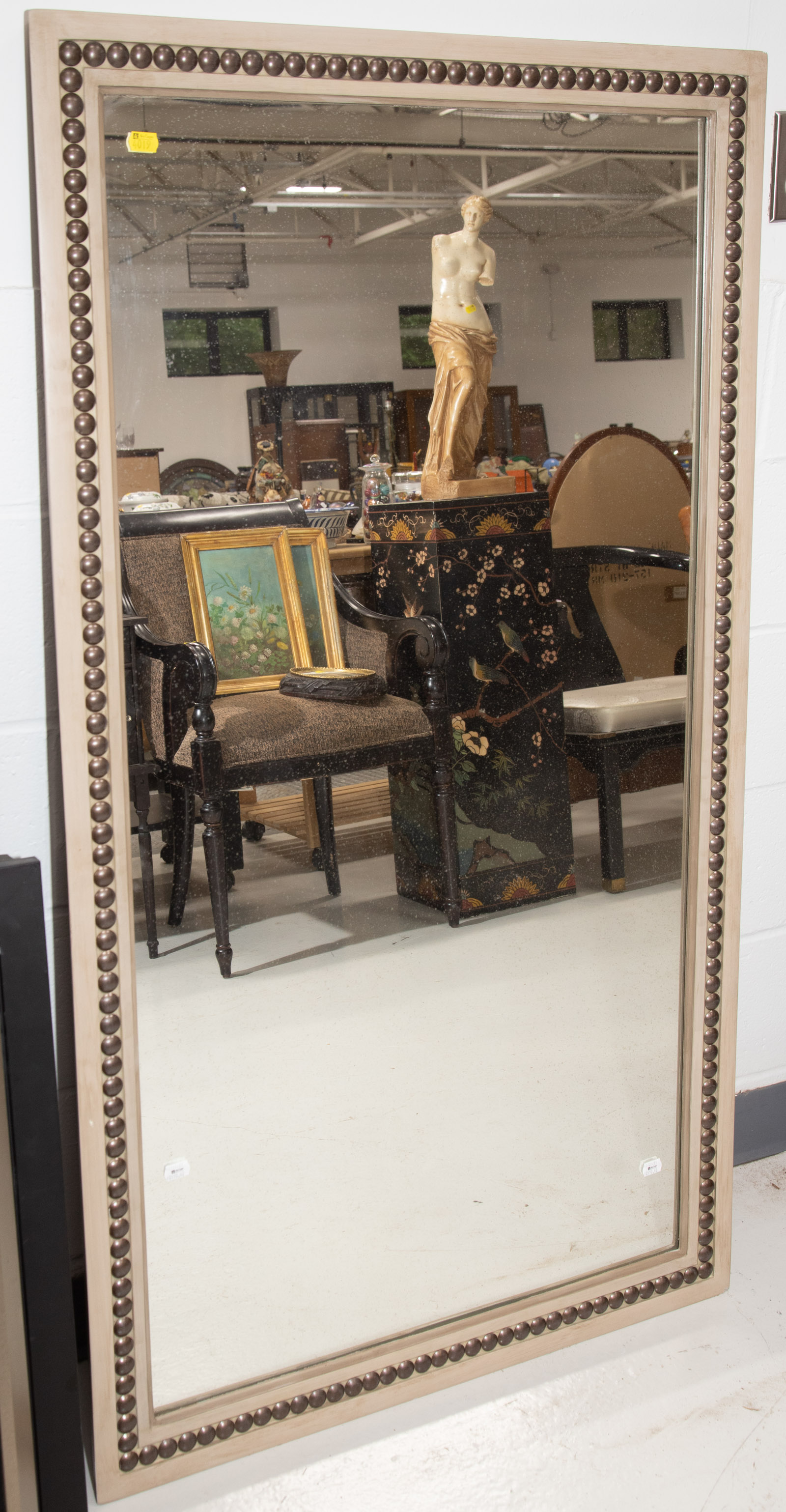 Appraisal: LARGE CONTEMPORARY STYLE MIRROR In a painted wood frame studded