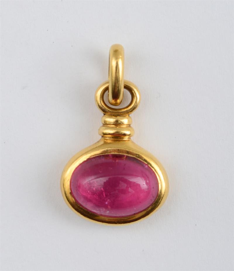 Appraisal: K GOLD AND PINK TOURMALINE PENDANT Polished pendant with a