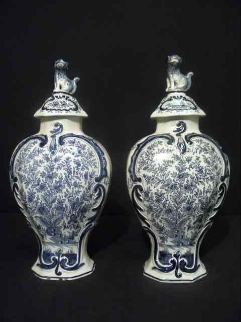 Appraisal: Pair of early Delft blue and white ceramic lidded urns