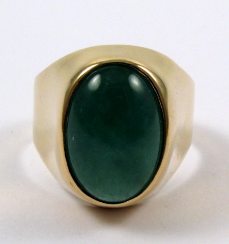 Appraisal: MAN'S GREEN JADE RING k yellow gold and centering an