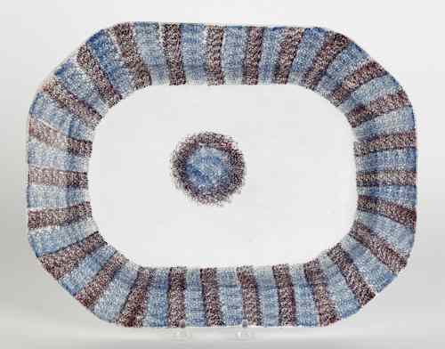 Appraisal: Blue and purple rainbow spatter platter with bull's-eye th c