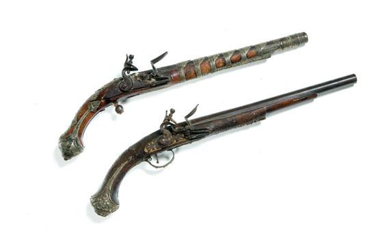 Appraisal: TWO FLINTLOCK PISTOLS Middle Eastern th century Both have cast