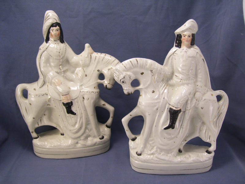 Appraisal: Pair Staffordshire Horesmen Measuring high and high Selling as a