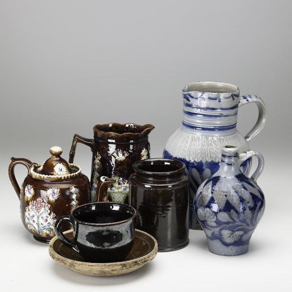 Appraisal: DECORATIVE POTTERY Eight assorted pieces include German stoneware pitcher and