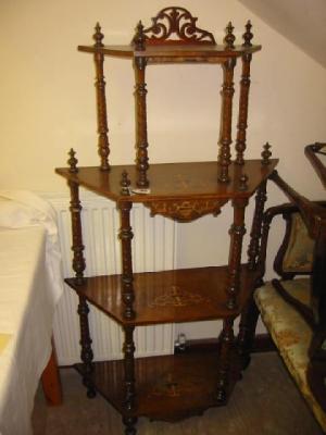 Appraisal: A VICTORIAN WALNUT WHATNOT of four tier canted form crossbanded