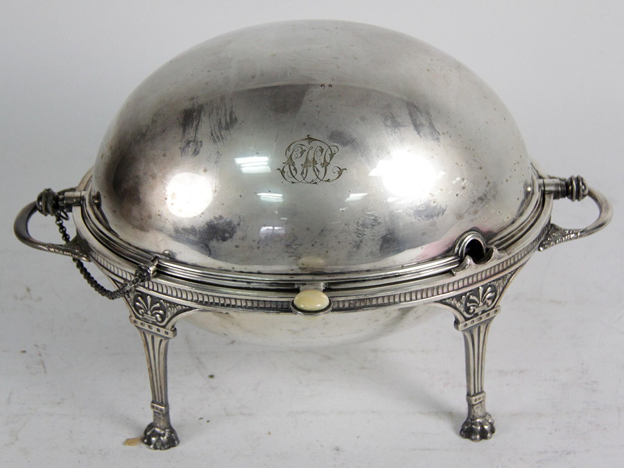 Appraisal: A Victorian breakfast heater the revolving cover on a stand