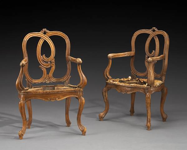 Appraisal: A pair of Italian Rococo style walnut armchairs second half