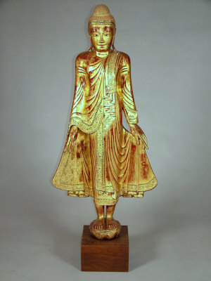 Appraisal: A Thai carved and giltwood full length standing figure of