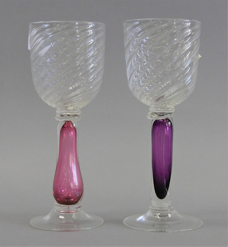 Appraisal: GLASS Set of fourteen glass water goblets colored stems twist