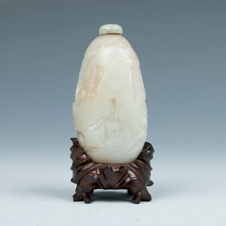 Appraisal: FOSHAN WHITE JADE SNUFF BOTTLE Of irregular pear shape decorated