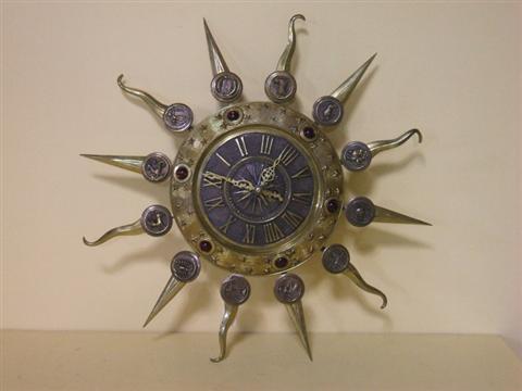 Appraisal: BRASS ZODIAC CLOCK In the form of the sun each