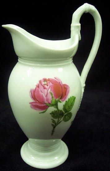 Appraisal: A Meissen small milk jug painted flowers marks crossed swords