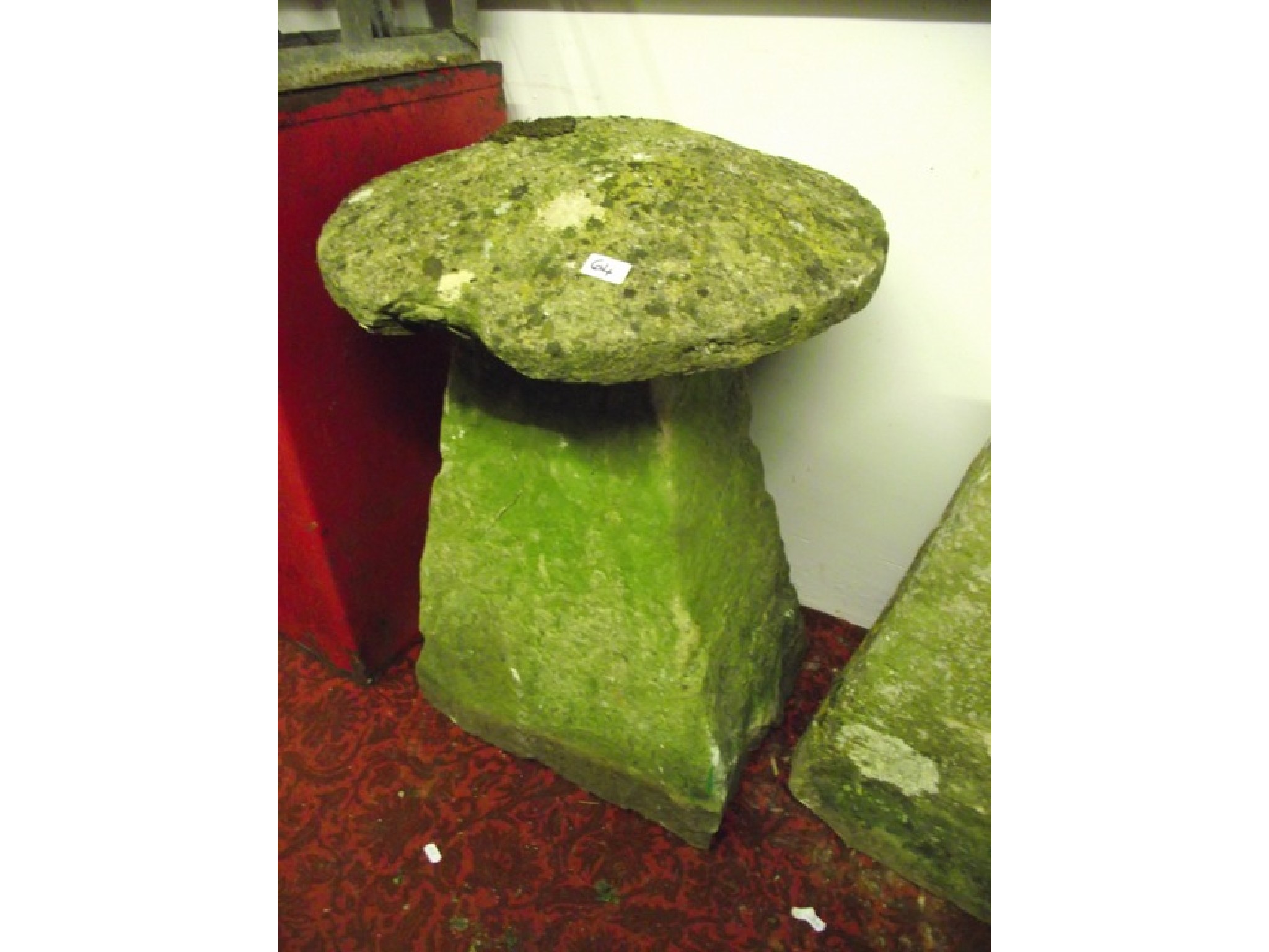 Appraisal: A natural stone staddle stone with square tapered base beneath