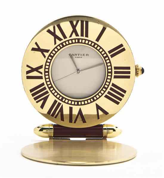 Appraisal: A Cartier Gilt Metal and Enameled Travel Clock of circular