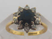 Appraisal: An carat yellow gold sapphire and diamond cluster ring the