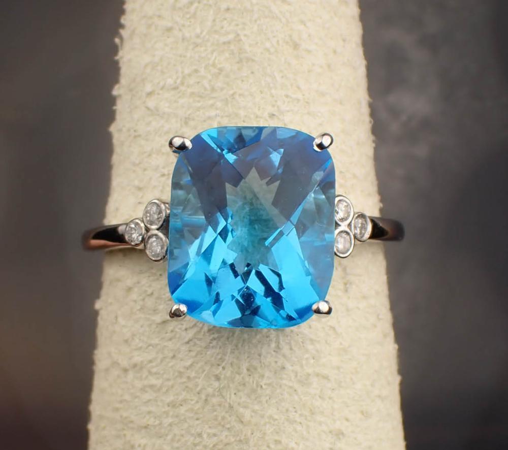 Appraisal: BLUE TOPAZ DIAMOND AND FOURTEEN KARAT GOLD RING The white