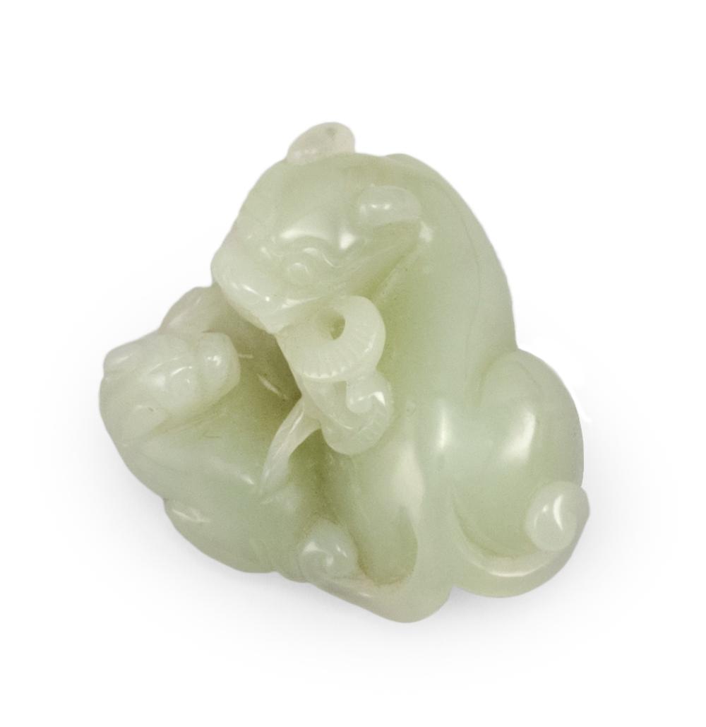 Appraisal: CHINESE CELADON JADE CARVING LENGTH CHINESE CELADON JADE CARVING A